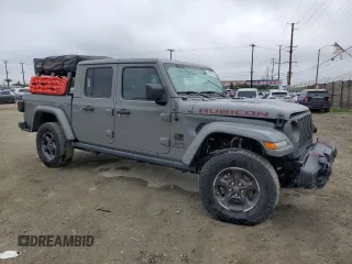 2021 Jeep Gladiator Rubicon with VIN 1C6JJTBG5ML615653, listed as a Copart auction lot 51297795 with 48,918 mi miles and Salvage title. Bid and sale history available at DreamBid. Image 4.