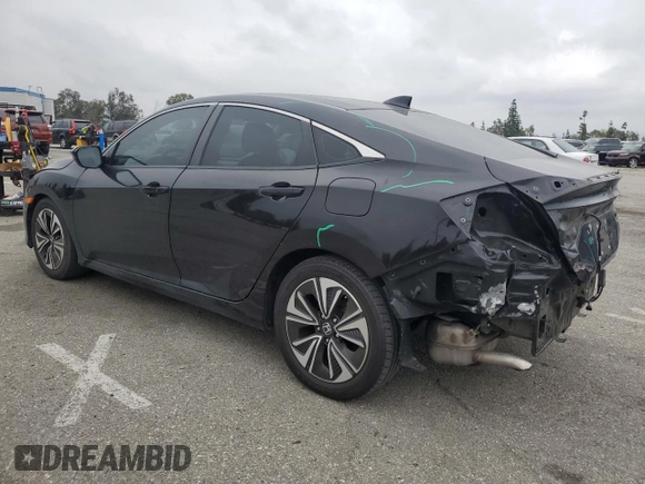 2016 Honda Civic EX-T z VIN 2HGFC1F33GH634029, wystawiony jako Copart lot #56026045 z przebiegiem 168 676 mil mil oraz Szkoda całkowita • Salvage title. Historia ofert i sprzedaży dostępna na DreamBid. Obrazek 2.