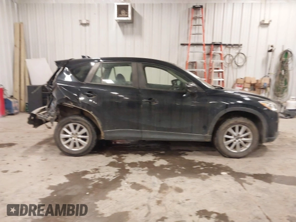 2015 Mazda CX-5 Sport with VIN JM3KE4BY0F0542655, listed as a IAAI auction lot 41471568 with 165,386 mi miles. Bid and sale history available at carsss.com. Image 13.