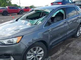 2021 Ford Edge Titanium z VIN 2FMPK3K9XMBA21766, wystawiony jako IAAI lot #42187940 z przebiegiem 79 732 mil mil oraz . Historia ofert i sprzedaży dostępna na DreamBid. Obrazek 6.