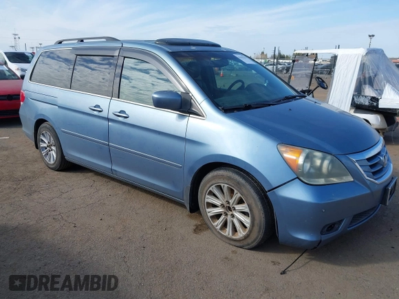 2008 Honda Odyssey Touring with VIN 5FNRL38868B047556, listed as a IAAI auction lot 41581617 with 220,436 mi miles. Bid and sale history available at carsss.com. Image 1.