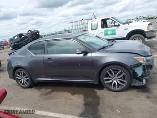 2015 Scion tC with VIN JTKJF5C73FJ008663, listed as a IAAI auction lot 41969395 with 125,758 mi miles. Bid and sale history available at carsss.com. Image 14.