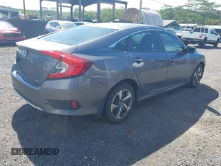 2020 Honda Civic LX z VIN 19XFC2F67LE001375, wystawiony jako IAAI lot #42033879 z przebiegiem 79 941 mil mil oraz . Historia ofert i sprzedaży dostępna na DreamBid. Obrazek 4.