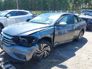 2021 Volkswagen Jetta SEL with VIN 3VWE57BU9MM098736, listed as a IAAI auction lot 42384031 with 28,070 mi miles and . Bid and sale history available at DreamBid. Image 2.