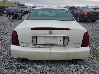 2000 Cadillac DeVille DTS z VIN 1G6KF5797YU263599, wystawiony jako Copart lot #81576484 z przebiegiem 118 414 mil mil oraz Szkoda całkowita • Salvage title. Historia ofert i sprzedaży dostępna na DreamBid. Obrazek 6.