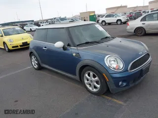 2009 MINI Cooper Hardtop with VIN WMWMF33559TZ20935, listed as a IAAI auction lot 41977679 with 122,157 mi miles. Bid and sale history available at carsss.com. Image 1.