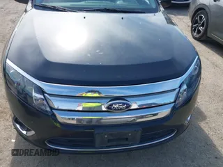 2012 Ford Fusion Hybrid z VIN 3FADP0L31CR380821, wystawiony jako IAAI lot #42332256 z przebiegiem 59 431 mil mil oraz . Historia ofert i sprzedaży dostępna na DreamBid. Obrazek 6.