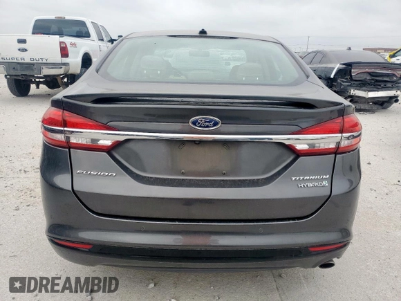 2017 Ford Fusion Hybrid Titanium with VIN 3FA6P0RU7HR388521, listed as a Copart auction lot 57318895 with 117,720 mi miles and Salvage title. Bid and sale history available at DreamBid. Image 6.