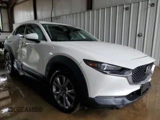 2023 Mazda CX-30 S Select z VIN 3MVDMBBM2PM521471, wystawiony jako Copart lot #63272965 z przebiegiem 26 879 mil mil oraz Szkoda całkowita • Salvage title. Historia ofert i sprzedaży dostępna na DreamBid. Obrazek 4.