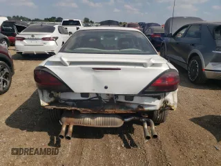 1999 Pontiac Grand Am GT with VIN 1G2NW12E0XM853038, listed as a Copart auction lot 69262194 with 162,986 mi miles and Salvage Title. Bid and sale history available at carsss.com. Image 6.
