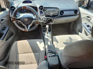2010 Honda Insight EX с VIN JHMZE2H75AS024918, выставлен на аукционе Copart как лот 66526265 с пробегом 312 605 миль миль и Списание • Salvage title. История ставок и продаж доступна на DreamBid. Изображение 8.