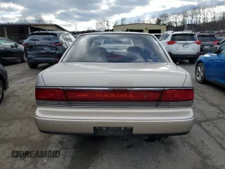 1990 Nissan Maxima z VIN JN1HJ01P8LT402950, wystawiony jako Copart lot #82714734 z przebiegiem 60 727 mil mil oraz Tytuł czysty. Historia ofert i sprzedaży dostępna na DreamBid. Obrazek 6.