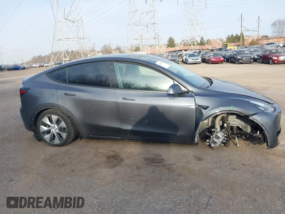 2023 Tesla Model Y Long Range with VIN 7SAYGAEEXPF612231, listed as a IAAI auction lot 41758243 with 32,924 mi miles and . Bid and sale history available at DreamBid. Image 14.
