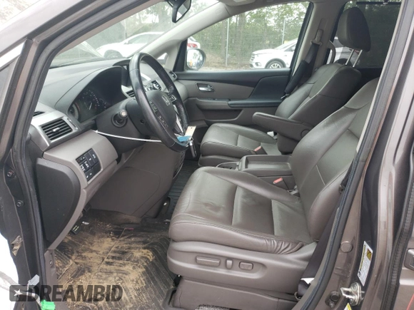 2014 Honda Odyssey Touring with VIN 5FNRL5H90EB014360, listed as a Copart auction lot 56699845 with 180,913 mi miles and Salvage title. Bid and sale history available at DreamBid. Image 7.