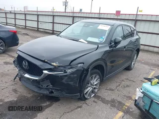 2020 Mazda CX-5 Grand Touring with VIN JM3KFADM8L0811910, listed as a IAAI auction lot 41446214 with 57,849 mi miles. Bid and sale history available at carsss.com. Image 2.