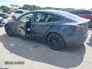 2022 Tesla Model 3 Performance with VIN 5YJ3E1EC9NF201184, listed as a IAAI auction lot 41534959 with 29,389 mi miles and . Bid and sale history available at DreamBid. Image 3.