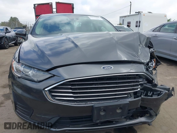 2019 Ford Fusion SE with VIN 3FA6P0LUXKR174476, listed as a IAAI auction lot 42110902 with 33,260 mi miles and . Bid and sale history available at DreamBid. Image 12.