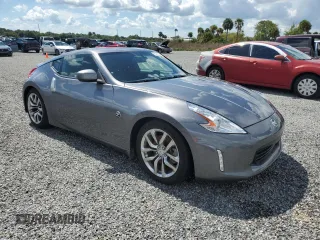 2014 Nissan 370Z with VIN JN1AZ4EH6EM633797, listed as a Copart auction lot 74027354 with Not Provided miles and Salvage Title. Bid and sale history available at DreamBid. Image 4.