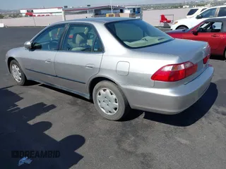 1999 Honda Accord LX with VIN JHMCG6650XC011621, listed as a IAAI auction lot 42401527 with 243,227 mi miles and . Bid and sale history available at DreamBid. Image 3.