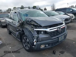 2017 Honda Ridgeline RTL-T with VIN 5FPYK2F65HB004473, listed as a IAAI auction lot 41132959 with 116,699 mi miles and . Bid and sale history available at DreamBid. Image 1.