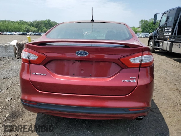 2013 Ford Fusion SE Hybrid z VIN 3FA6P0LUXDR335590, wystawiony jako Copart lot #60541395 z przebiegiem 121 975 mil mil oraz Szkoda całkowita • Salvage title. Historia ofert i sprzedaży dostępna na DreamBid. Obrazek 6.