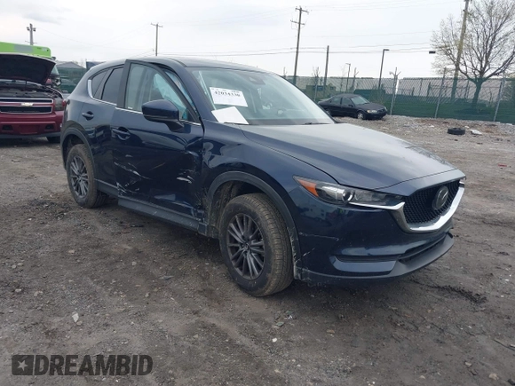 2021 Mazda CX-5 Touring with VIN JM3KFBCM1M1336457, listed as a IAAI auction lot 42034330 with 39,910 mi miles. Bid and sale history available at carsss.com. Image 1.