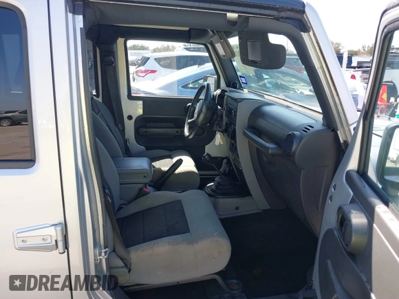 2010 Jeep Wrangler Unlimited Sport with VIN 1J4BA3H17AL211887, listed as a IAAI auction lot 41778324 with 185,626 mi miles. Bid and sale history available at carsss.com. Image 5.
