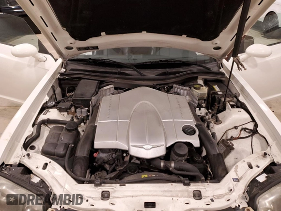 2004 Chrysler Crossfire с VIN 1C3AN69L64X009535, выставлен на аукционе Copart как лот 51344405 с пробегом Не указан миль и На запчасти • Non repairable. История ставок и продаж доступна на DreamBid. Изображение 11.