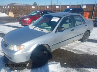 2002 Mazda Protege DX with VIN JM1BJ225321588015, listed as a IAAI auction lot 41409015 with 170,815 mi miles and . Bid and sale history available at DreamBid. Image 2.