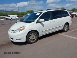 2010 Toyota Sienna XLE with VIN 5TDYK4CC7AS291119, listed as a IAAI auction lot 41742917 with 201,590 mi miles. Bid and sale history available at carsss.com. Image 2.