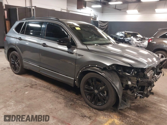2022 Volkswagen Tiguan SE R-Line Black with VIN 3VV8B7AX1NM111194, listed as a IAAI auction lot 42254124 with 22,748 mi miles and . Bid and sale history available at DreamBid. Image 1.