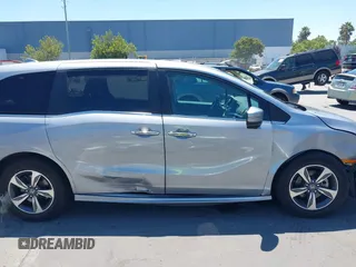 2018 Honda Odyssey Touring with VIN 5FNRL6H81JB022975, listed as a IAAI auction lot 42653304 with 210,137 mi miles and . Bid and sale history available at DreamBid. Image 14.