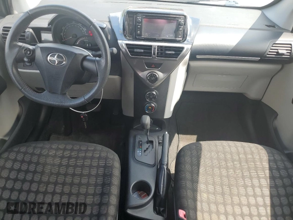 2014 Scion iQ with VIN JTNJJXB07EJ028558, listed as a Copart auction lot 64745345 with 112,221 mi miles and Clean title. Bid and sale history available at DreamBid. Image 8.