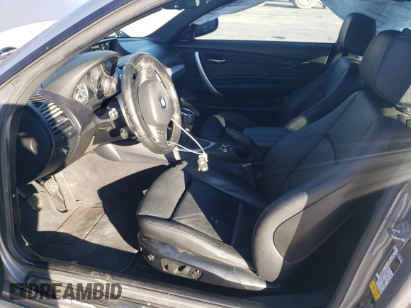 2012 BMW 1 Series 135i with VIN WBAUC9C5XCVM11673, listed as a Copart auction lot 88550445 with 119,456 mi miles and Salvage title. Bid and sale history available at DreamBid. Image 7.