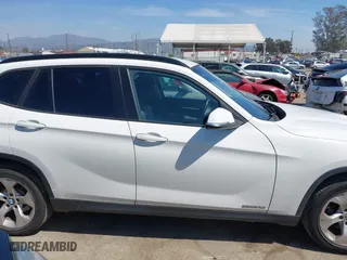 2014 BMW X1 sDrive28i with VIN WBAVM1C5XEVW53725, listed as a IAAI auction lot 41859427 with 181,892 mi miles. Bid and sale history available at carsss.com. Image 14.