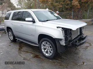 2015 GMC Yukon SLT with VIN 1GKS2BKC0FR676107, listed as a IAAI auction lot 41962929 with 132,389 mi miles. Bid and sale history available at carsss.com. Image 1.