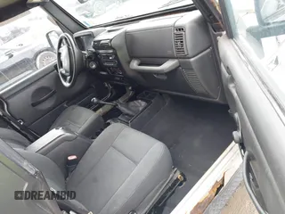 2006 Jeep Wrangler X with VIN 1J4FA39S46P789017, listed as a IAAI auction lot 41904218 with 240,507 mi miles. Bid and sale history available at carsss.com. Image 5.