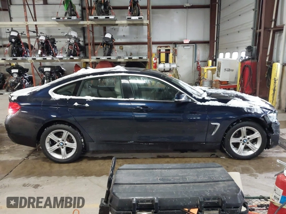 2015 BMW 4 Series 428i xDrive with VIN WBA4A7C57FD414955, listed as a IAAI auction lot 41609214 with 69,125 mi miles and . Bid and sale history available at DreamBid. Image 13.