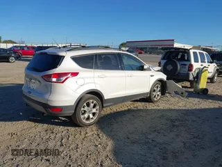 2013 Ford Escape SEL with VIN 1FMCU0HX9DUA51686, listed as a IAAI auction lot 40650669 with 86,442 mi miles. Bid and sale history available at carsss.com. Image 4.