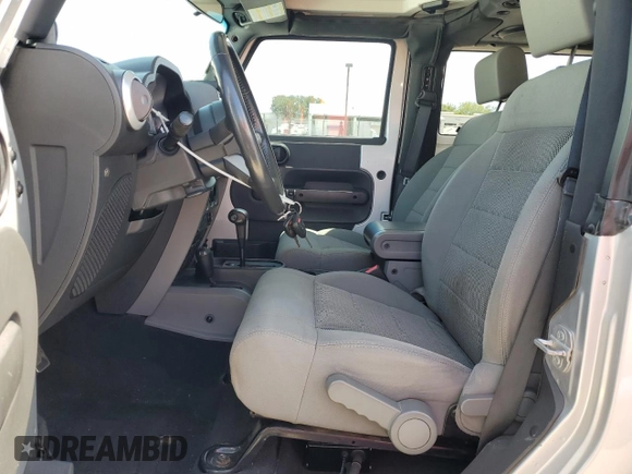 2009 Jeep Wrangler Sahara with VIN 1J4FA54149L708183, listed as a Copart auction lot 65989125 with 133,436 mi miles and Salvage title. Bid and sale history available at DreamBid. Image 7.
