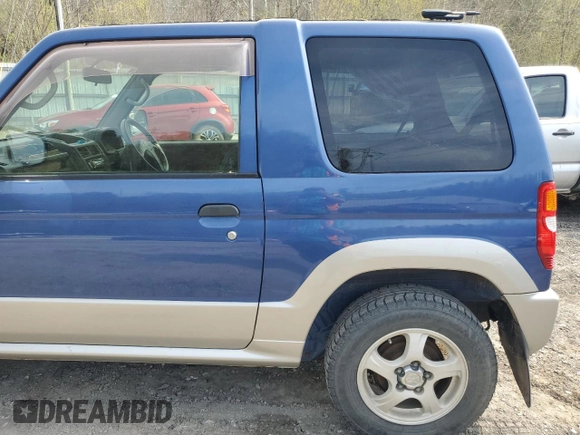 1999 Mitsubishi Montero z VIN H58A0013724, wystawiony jako Copart lot #52986435 z przebiegiem 88 711 mil mil oraz Szkoda całkowita • Salvage title. Historia ofert i sprzedaży dostępna na DreamBid. Obrazek 11.