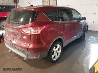 2014 Ford Escape SE with VIN 1FMCU9GX7EUA33937, listed as a IAAI auction lot 41504576 with 104,908 mi miles. Bid and sale history available at carsss.com. Image 4.