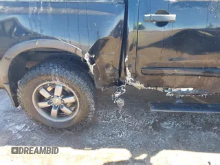 2014 Nissan Titan S with VIN 1N6AA0EC6EN506928, listed as a IAAI auction lot 41380319 with 102,669 mi miles and . Bid and sale history available at DreamBid. Image 6.