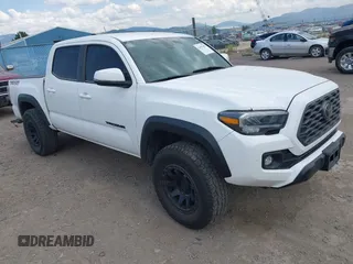 2022 Toyota Tacoma SR with VIN 3TMCZ5AN1NM478457, listed as a IAAI auction lot 42479107 with 59,547 mi miles and . Bid and sale history available at DreamBid. Image 1.