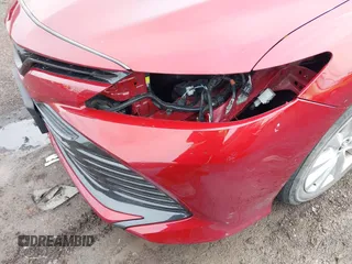 2019 Toyota Camry LE with VIN 4T1B11HK8KU823736, listed as a IAAI auction lot 42166696 with 21,732 mi miles and . Bid and sale history available at DreamBid. Image 6.