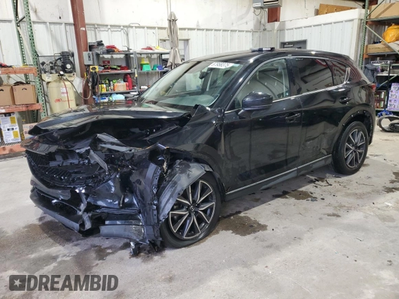 2018 Mazda CX-5 Grand Touring with VIN JM3KFADM3J0325843, listed as a Copart auction lot 87958375 with 93,577 mi miles and Salvage title. Bid and sale history available at DreamBid. Image 1.