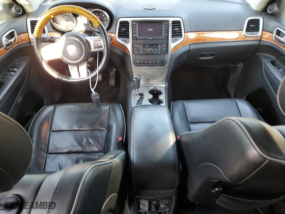 2012 Jeep Grand Cherokee Overland with VIN 1C4RJFCG4CC292383, listed as a Copart auction lot 51168385 with 132,697 mi miles and Salvage Title. Bid and sale history available at carsss.com. Image 8.