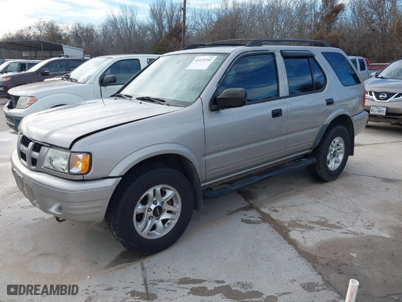 2004 Isuzu Rodeo S with VIN 4S2CK58W344311048, listed as a IAAI auction lot 41472392 with 128,732 mi miles. Bid and sale history available at carsss.com. Image 2.