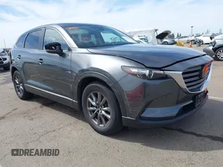 2021 Mazda CX-9 Sport with VIN JM3TCBBY7M0520437, listed as a IAAI auction lot 42022562 with 77,063 mi miles and . Bid and sale history available at carsss.com. Image 1.