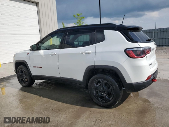 2023 Jeep Compass Trailhawk with VIN 3C4NJDDN5PT567737, listed as a Copart auction lot 61824665 with 43,843 mi miles and Clean title. Bid and sale history available at DreamBid. Image 2.